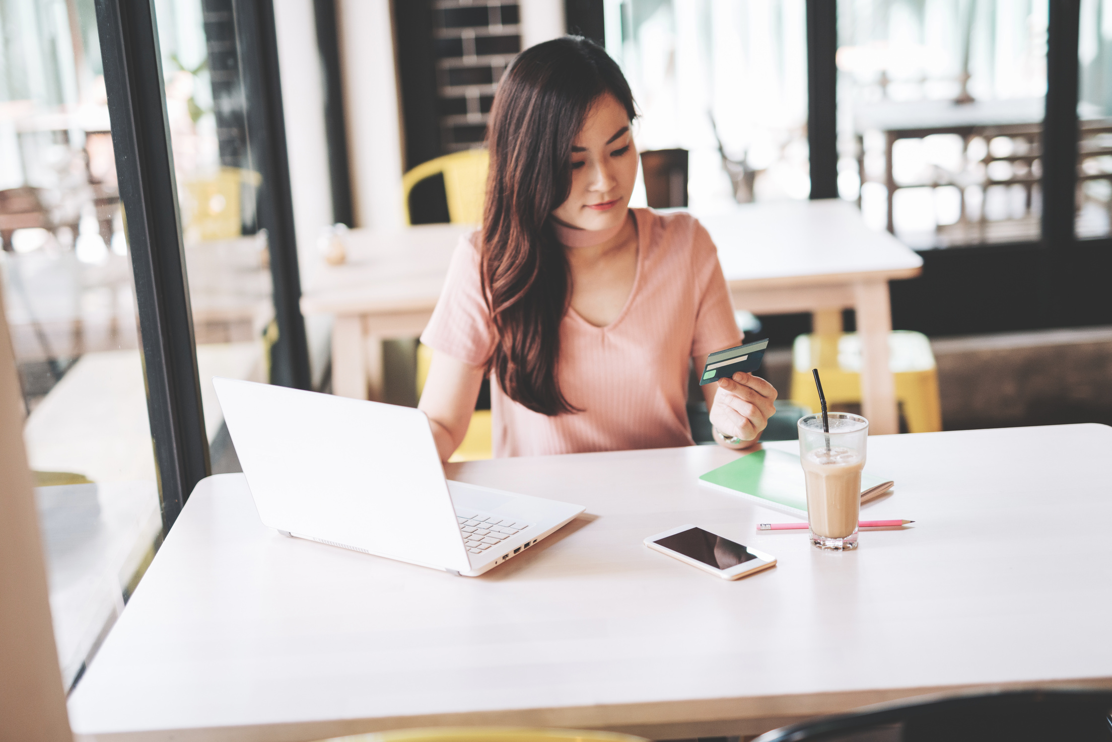 East Asian millennial woman investing in finances and technologies